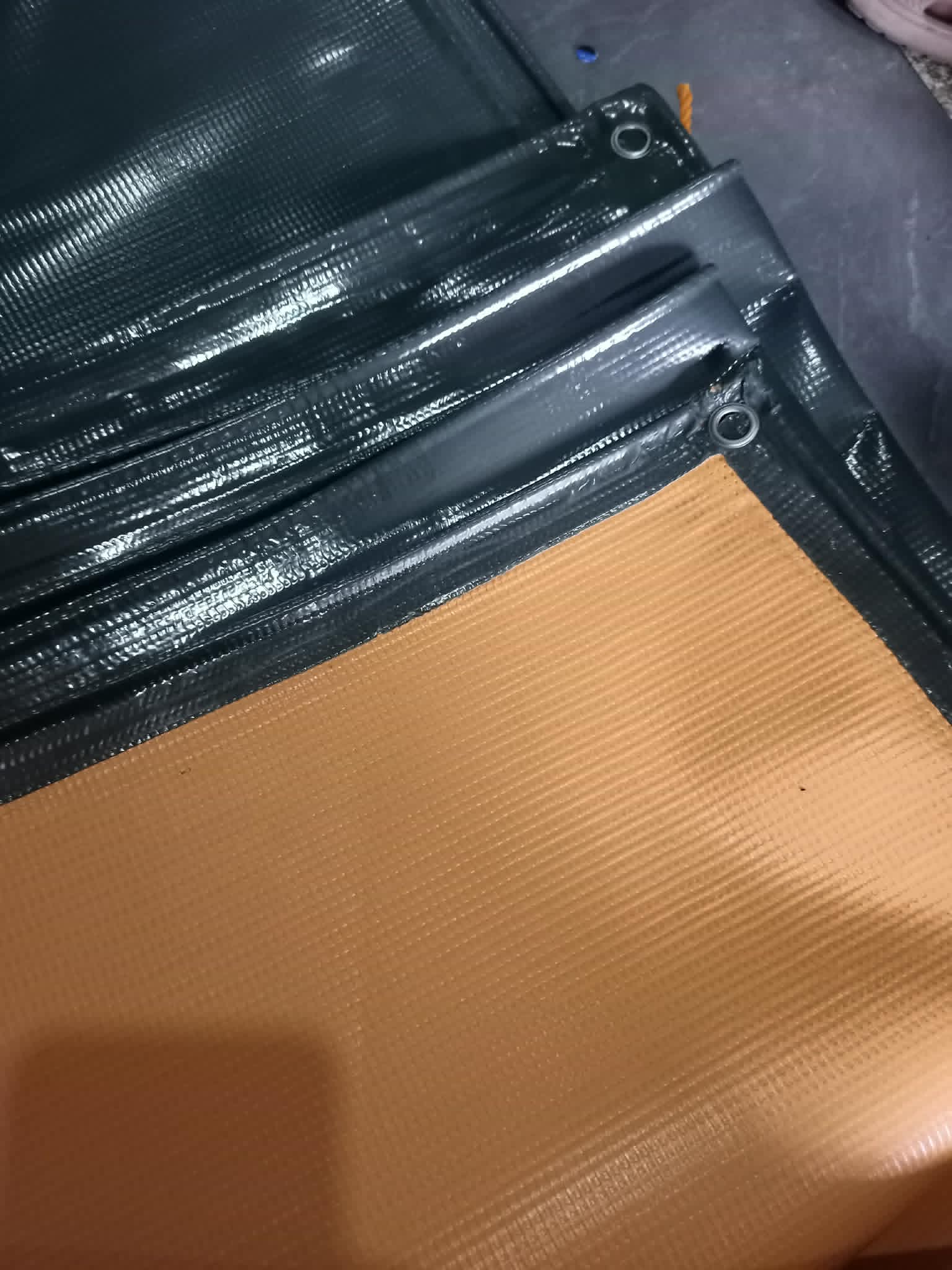 Black and tan reinforced tarp
